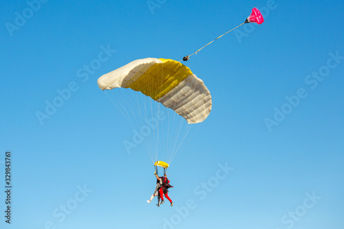 Tandem parachuting. Tandem skydiving on a large parachute.