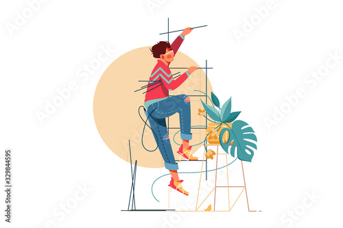Young handsome man climbs upstairs for repair work.