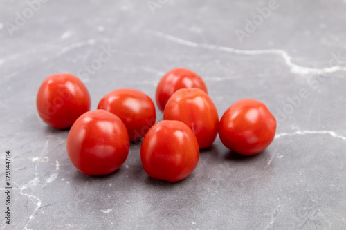 Cherry tomatoes on a marble board side view