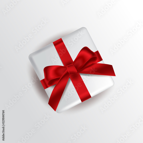 Vector illustration. White gift box with a red bow. Template for advertising design.