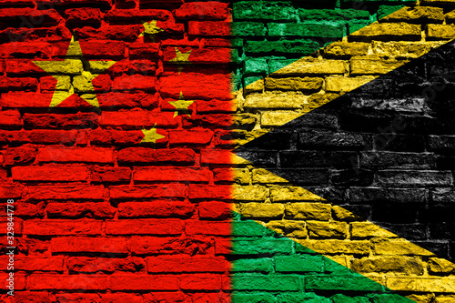 Flag of China and Jamaica on brick wall