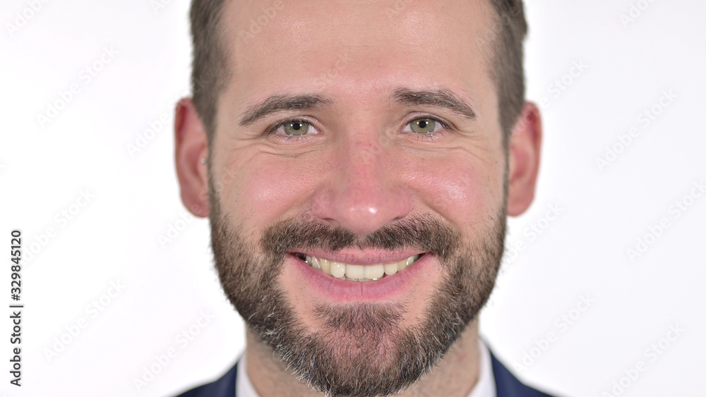 Obraz premium Close up of Smiling Face of Man at the Camera, White Background