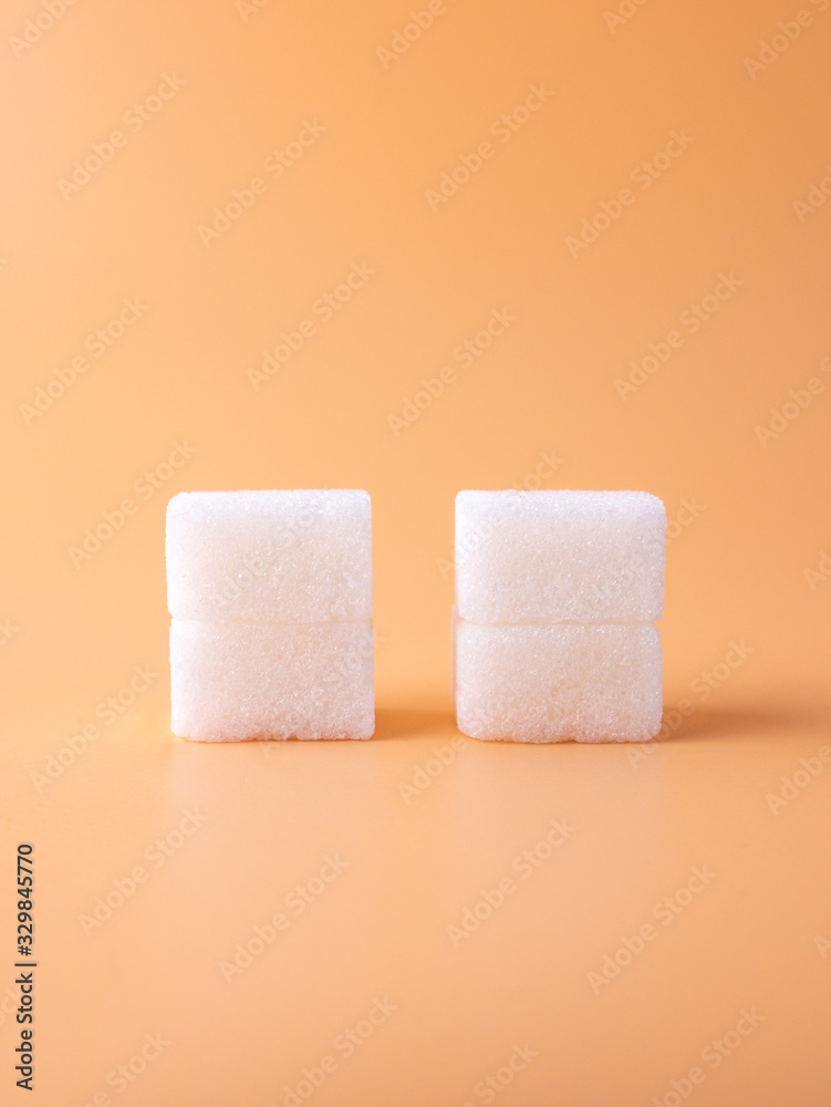 close up look to two white sugar cubes close up look to two white sugar cubes