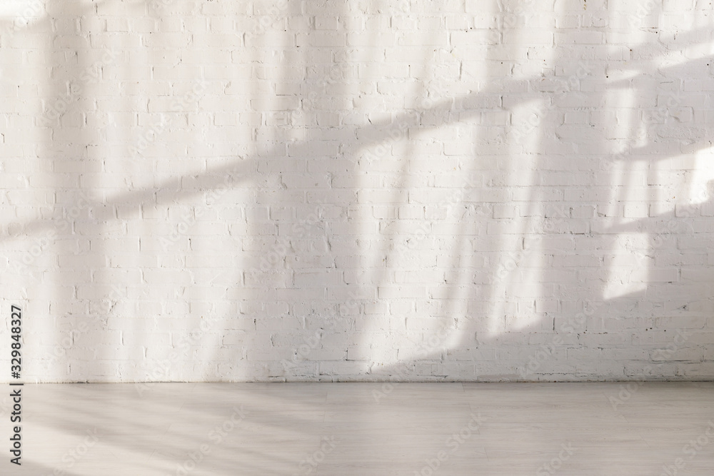sunlight and shadows on brick wall in empty yoga studio - obrazy, fototapety, plakaty 
