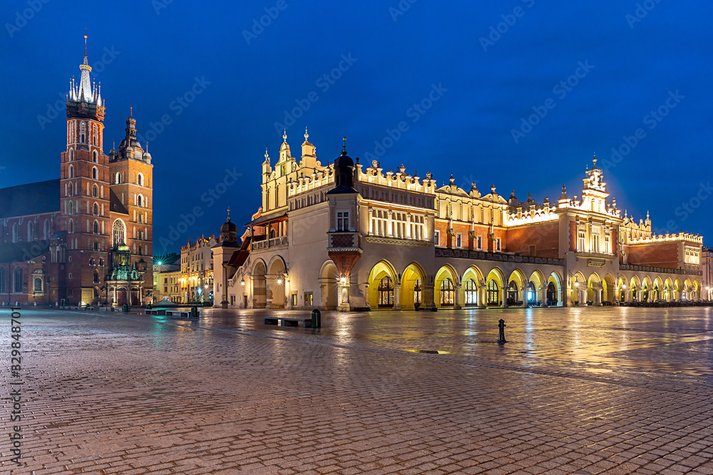 Krakow. Market square in the night lights at sunrise.