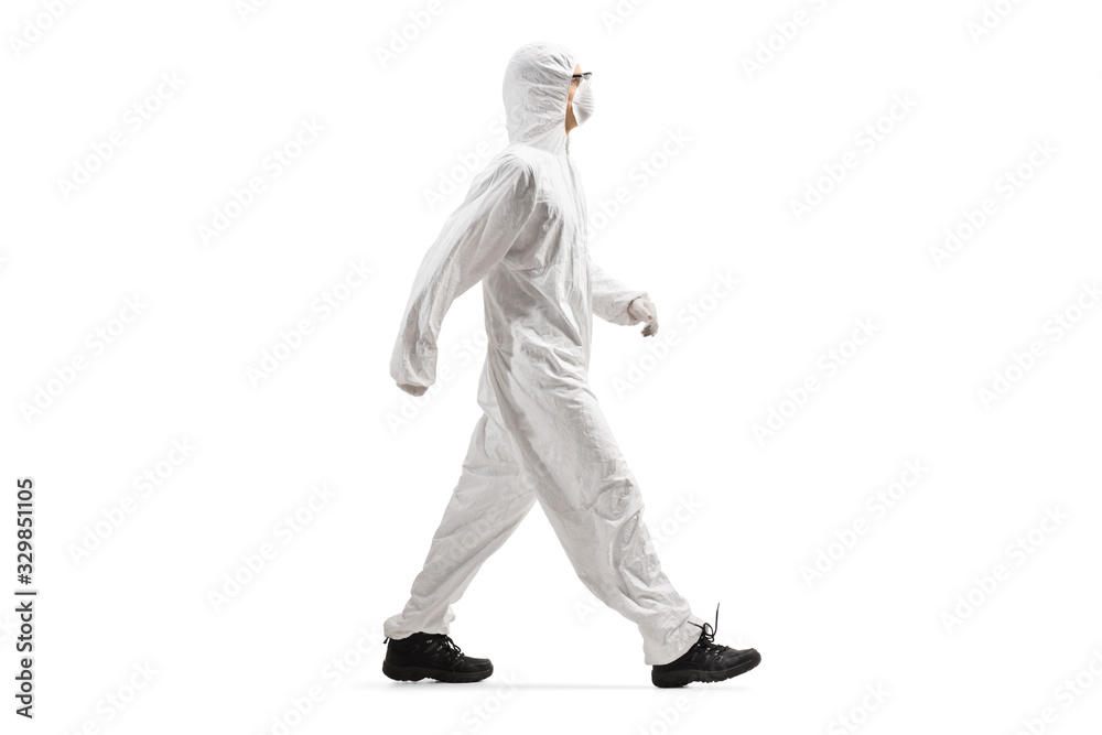 Man wearing a protective suit and mask and walking Man wearing a protective suit and mask and walking