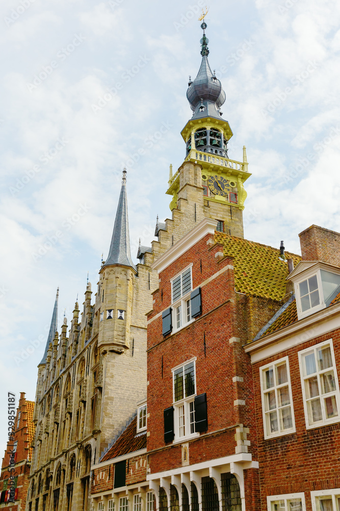 historic houses with steeple of the historic town hall, Veere, Netherlands