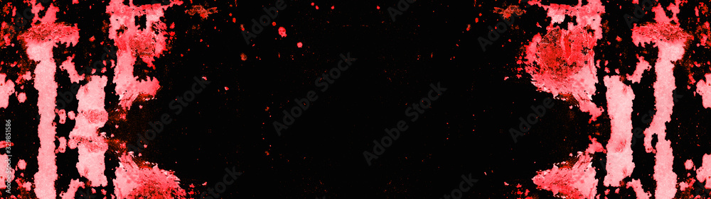 Frame of red neon painted abstract speckled splashes of color isolated on black background banner panorama