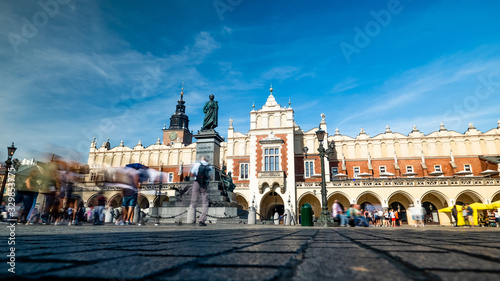 Krakow, Poland, view on the the old town market square and Cloth Hall with blurred pedestrians