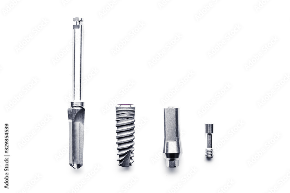 Set of medical implantation screw tools isolated on white background Set of medical implantation screw tools isolated on white background