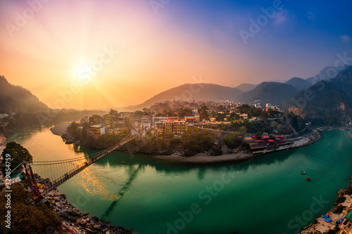 Obraz na plátně View of Ganga river embankment, Lakshman Jhula bridge and Trimbakeshwar Temple i