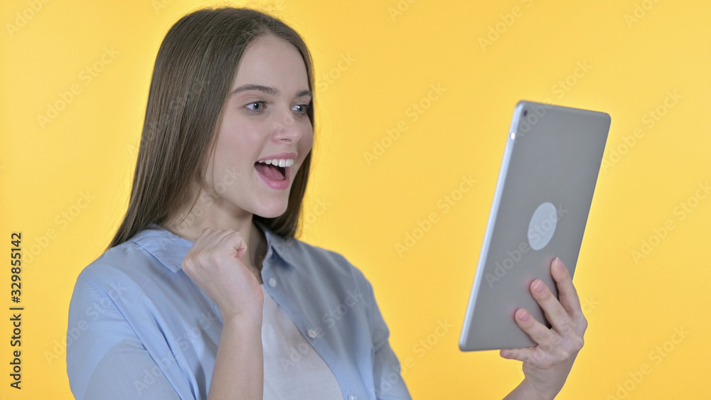 Portrait of Cheerful Young Woman Celebrating on Tablet Portrait of Cheerful Young Woman Celebrating on Tablet