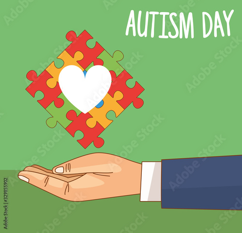 world autism day with hand lifting puzzle pieces