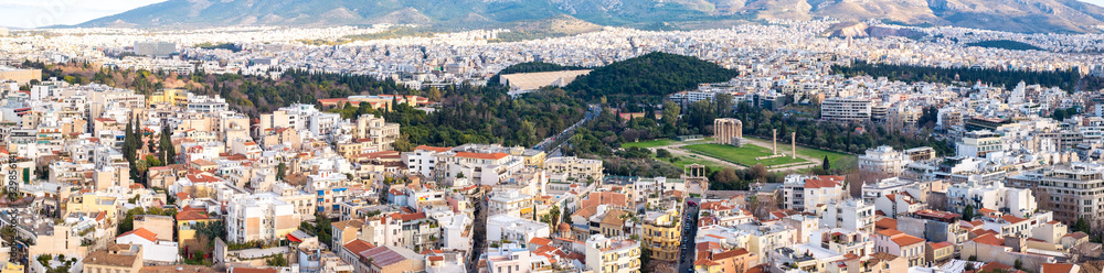 Naklejka premium Panoramic view over the Athens city with Temple of Olympian Zeus taken from Acropolis