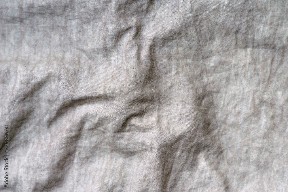 Crumpled fabric texture, light cloth background
