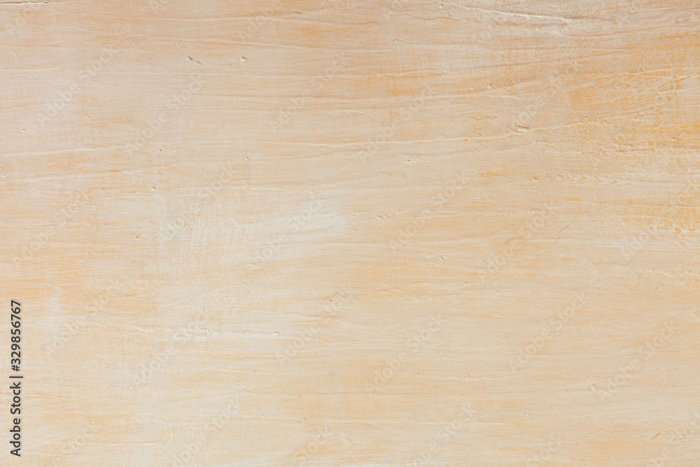 Naklejka premium strokes of yellow paint on white wall. paper texture background. yellow wall background