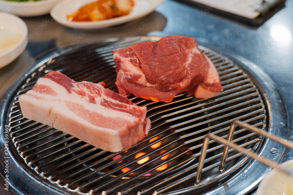 Preparing Traditional Korean Barbecue Grill Pork.