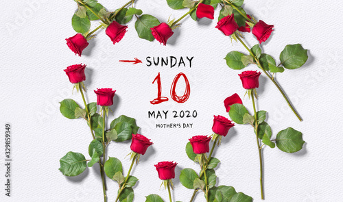 calendar with Mother's Day 2020 surrounded by roses in a heart shape on paper background