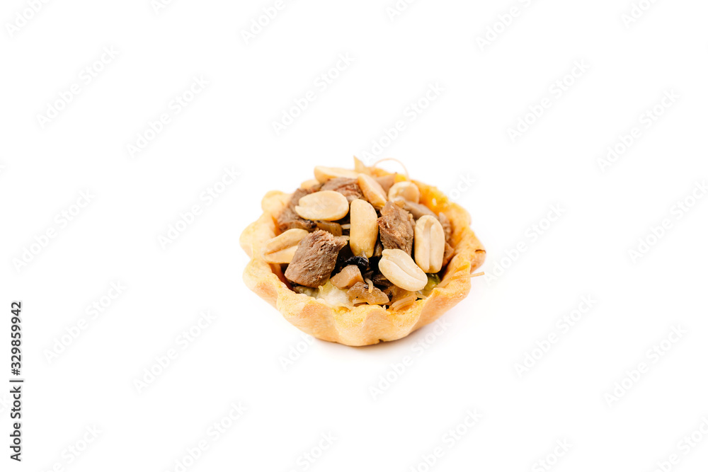 tartlet with meat and nuts isolated on white background tartlet with meat and nuts isolated on white background