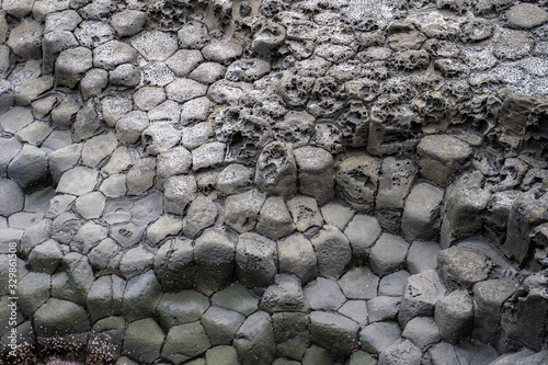 Texture Basaltic Volcanic Columnar Joints Coast in JungMun in Jeju Island, South Korea. photo