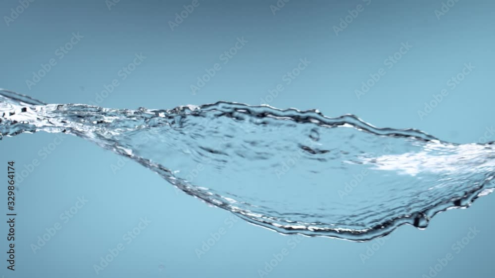 Super slow motion of splashing water rotation isolated on blue background. Filmed on very high speed camera, 1000 fps. Super slow motion of splashing water rotation isolated on blue background. Filmed on very high speed camera, 1000 fps.
