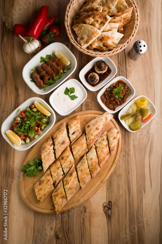 turkish meat pide on wooden table