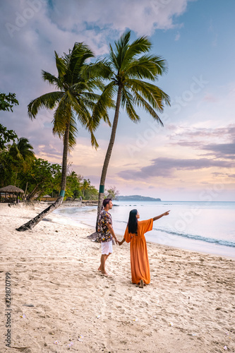 Saint Lucia Caribbean Island, couple on luxury vatation at the tropical Island of Saint Lucia, men and woman by the beach and crystal clear ocean of St Lucia Caribbean Holliday photo