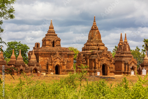 Buddhist pagoda temple. Bagan  Myanmar. Home of the largest and denset concentration of religion Buddhist temples  pagodas  stupas and ruins in the world. Blue sky with clouds.