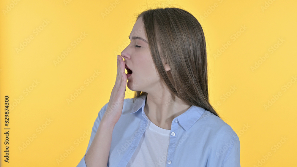 Sleepy Casual Young Woman Yawning , Yellow Background Sleepy Casual Young Woman Yawning , Yellow Background