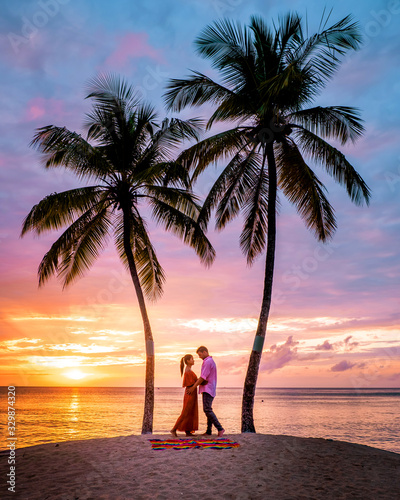 Saint Lucia Caribbean Island, couple on luxury vatation at the tropical Island of Saint Lucia, men and woman by the beach and crystal clear ocean of St Lucia Caribbean Holliday photo