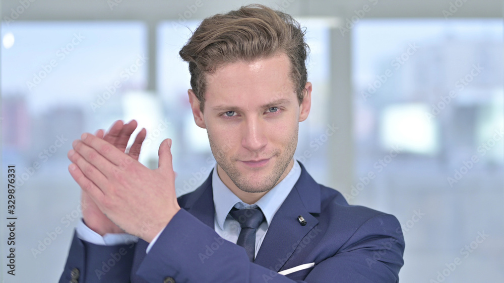 Portrait of Cheerful Young Businessman Clapping, Applauding Portrait of Cheerful Young Businessman Clapping, Applauding