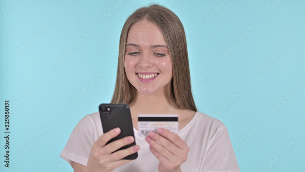 Online Payment on Smartphone by Young Woman, Blue Background