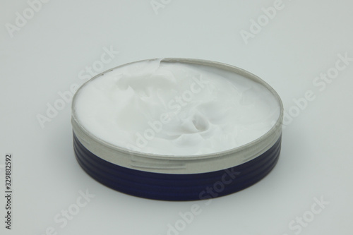 hand cream opened can on a white background