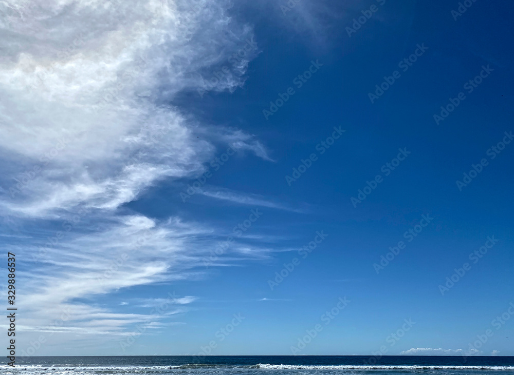 Wishpy white clouds in a clear, blue sky Wishpy white clouds in a clear, blue sky