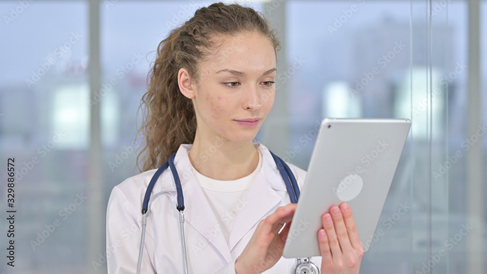 Portrait of Serious Young Female Doctor using Tablet Portrait of Serious Young Female Doctor using Tablet