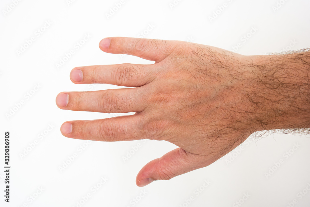 White Caucasian male hand and extended fingers close up shot isolated against bright white background White Caucasian male hand and extended fingers close up shot isolated against bright white background