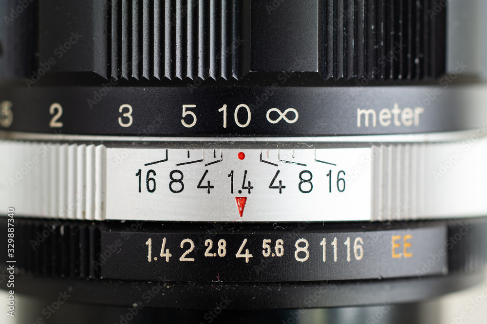 Front view macro shot of a vintage photography fast aperture prime lens  with inscribed indented markings on silver aperture ring and black metal  barrel Stock Photo | Adobe Stock