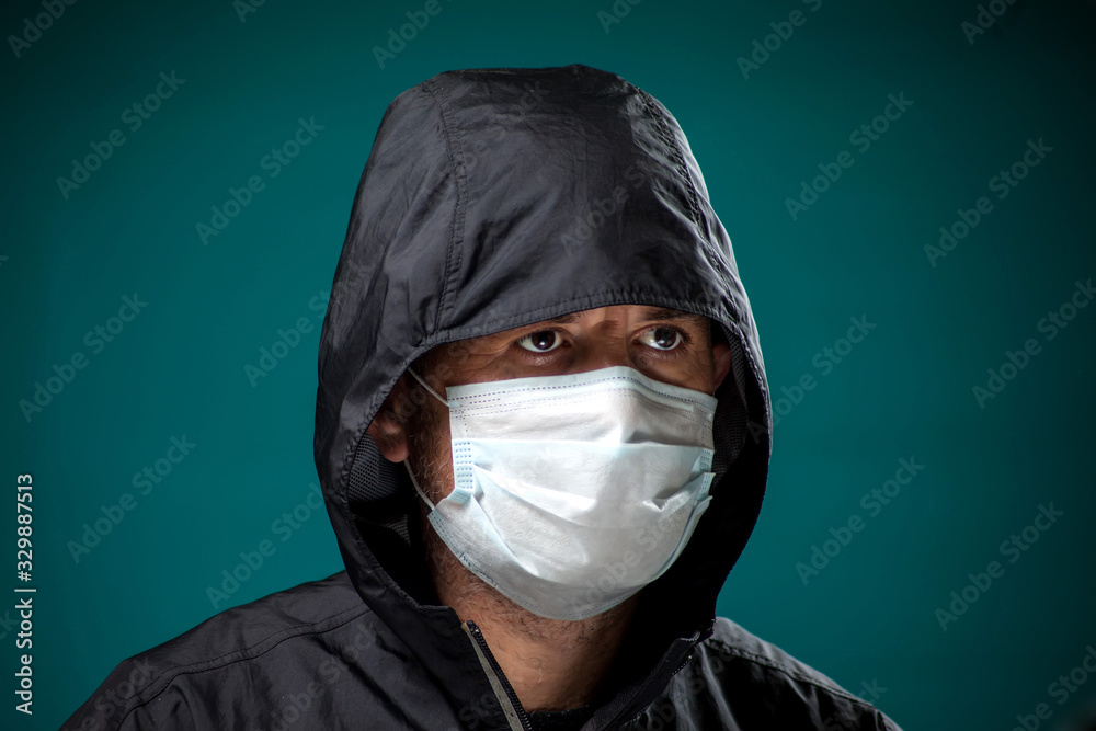 A portrait of man with medical face mask. People, medicine, healthcare concept. Coronavirus protection A portrait of man with medical face mask. People, medicine, healthcare concept. Coronavirus protection