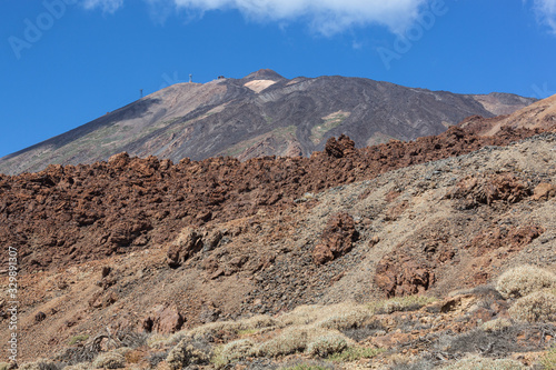 View of top of Teide mountain against the blue sky background, Tenerife, Canary Islands, Spain.