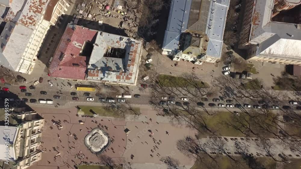Aerial view to historic and tourist center of Lviv city from above. Roofs of historic buildings and roads with tourist on it, Ukraine Aerial view to historic and tourist center of Lviv city from above. Roofs of historic buildings and roads with tourist on it, Ukraine