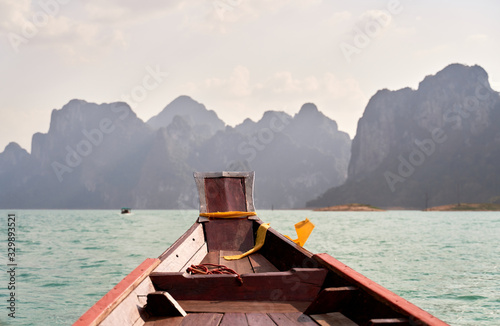 Thai passenger boat. Khao SOK national Park is nature reserve in South of Thailand with dense untouched jungles, limestone karst formations, an artificial lake Cheo LAN Surat Thani. February 26, 2020 photo