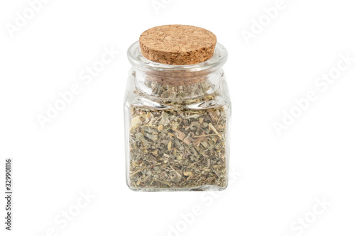 wormwood herb or in latin Absinthii herba herb in a glass jar isolated on white background. medicinal healing herbs. herbal medicine. alternative medicine