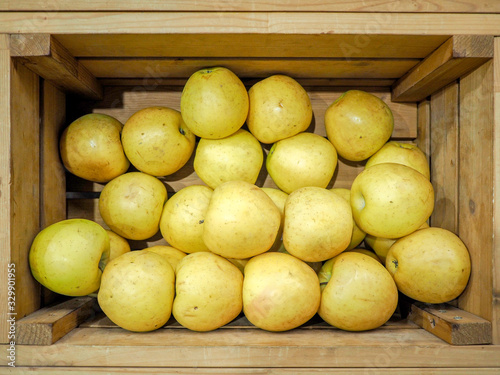 Organic apples harvest in wooden box