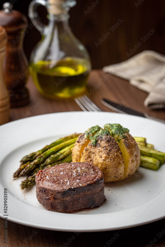 bacon wrapped tenderloin steak on white plate