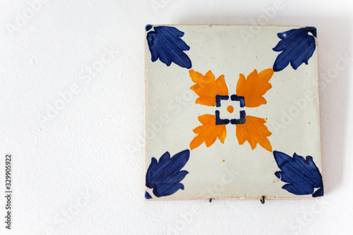 Only one Portuguese Azulejo closeup on a white wall
