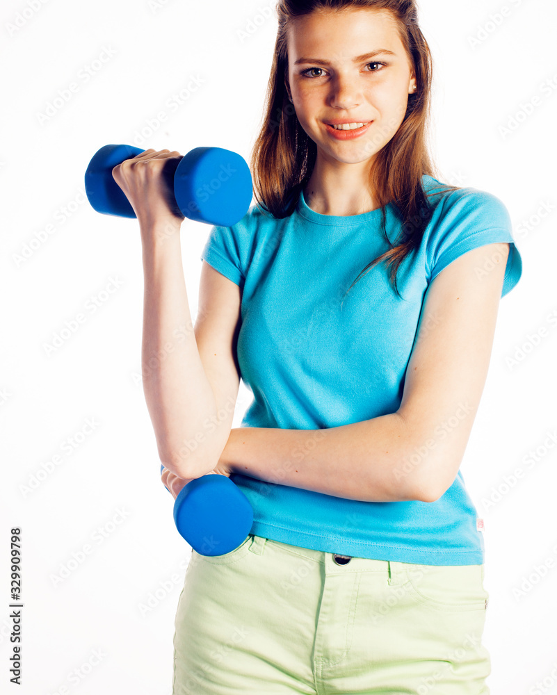 young pretty slim woman with dumbbell isolated on white background, cheerful smiling young pretty slim woman with dumbbell isolated on white background, cheerful smiling