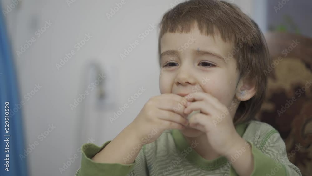 the child eats an egg. In preparation for Easter, the child took the egg and eat it the child eats an egg. In preparation for Easter, the child took the egg and eat it