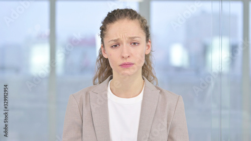 Portrait of Upset Young Businesswoman Crying at Camera