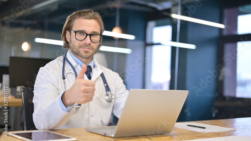 Confident Doctor Showing Thumbs Up at Work