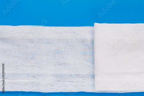Canvas-taulu Image of a piece of gauze on a blue background